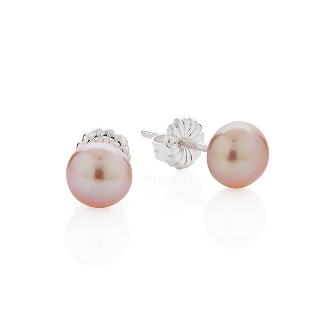 Button pink pearl studs by Claudia Bradby